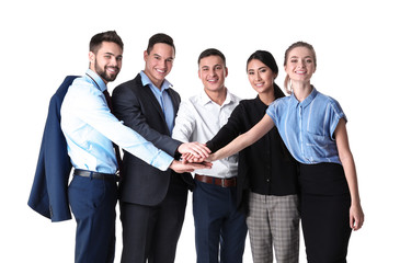 Young people putting hands together on white background