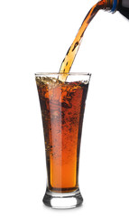 Pouring of tasty soda into glass on white background