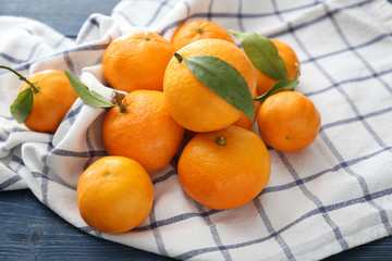 Tasty tangerines on wooden table