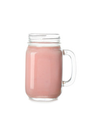 Mason jar of tasty milkshake on white background
