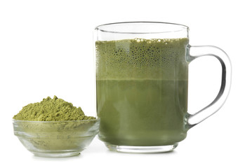 Cup of matcha tea and bowl with powder on white background