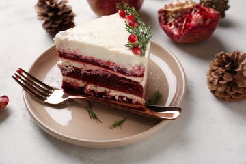 Piece of tasty Christmas cake on light table