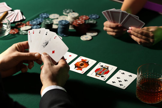 Male player at table in casino
