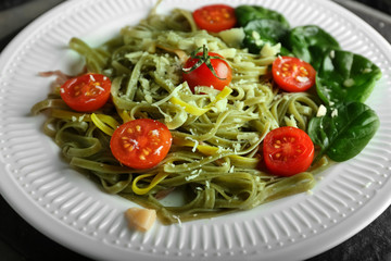 Plate of tasty color pasta with tomatoes and cheese, closeup