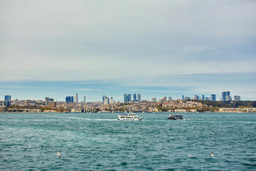 View to Istanbul and passenger ferry. River of the Bosphorus.