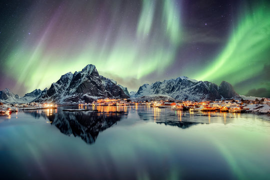 Aurora Borealis Dancing On Mountain In Fishing Village