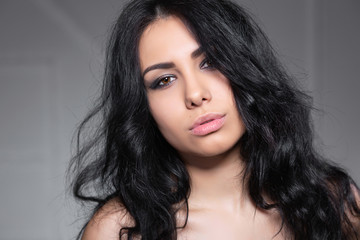 Fototapeta premium Cute young brunette posing in the studio