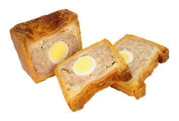 Traditional English savoury gala egg pork pie with crusty hot water pastry isolated on a white background