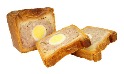 Traditional English savoury gala egg pork pie with crusty hot water pastry isolated on a white background