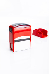 Pieczątka biurowa. Mechanizm pieczątki na białym tle.