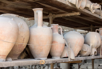 Vessels, pots and a variety of artifacts surviving eruption of Vesuvius in Pompeii  have been excavated and catalogued .Pompei, Italy
