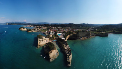 Fototapeta na wymiar Aerial drone photo of iconic white rock steep cliff volcanic bay of Cape Drastis and Peroulades area with tropical deep turquoise clear sea, Corfu island, Ionian, Greece