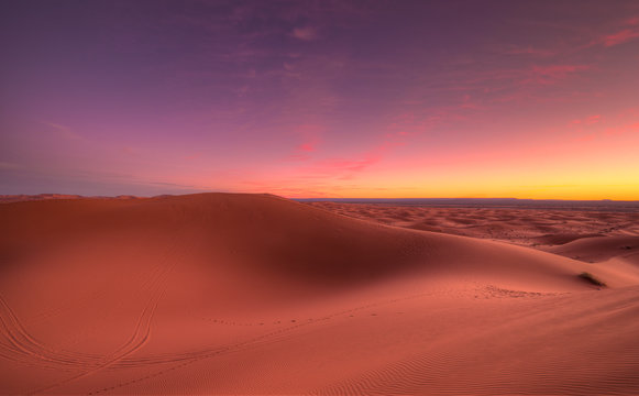 Amazing sunrise over the dunes Erg Chebbi in the Sahara desert near Merzouga, Morocco , Africa. Beautiful sand landscape with stunning sky