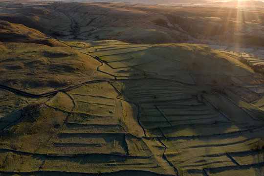 Morning Sunrise Malham North Yorkshire Yorkshire Dales Frost WInter Ariel Drone Flare Hills Grassland Walls Trees countryside uk