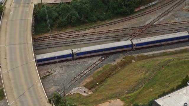 North Carolina Raleigh Aerial v9 Panning around following moving train near Central Prison 10/17