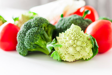 Vegetable variety on wooden white table. Selection of summer and autumn vegetables, space for text