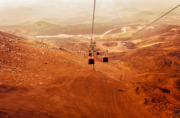 Obraz premium Elevators lift tourists to Mount Etna at sunrise, Catania, Sicily, Italy