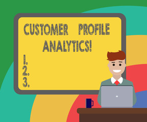 Conceptual hand writing showing Customer Profile Analytics. Business photo showcasing Customer profile or target market analysis Bordered Board behind Man Smiling with Laptop Mug on Desk