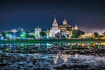 Fototapeta premium Night view of El Rocio church and town reflected