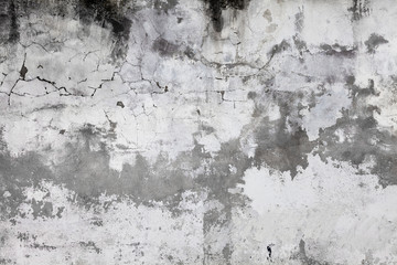 Cracked concrete wall covered with gray cement surface. Old grunge textures backgrounds. Plaster wall