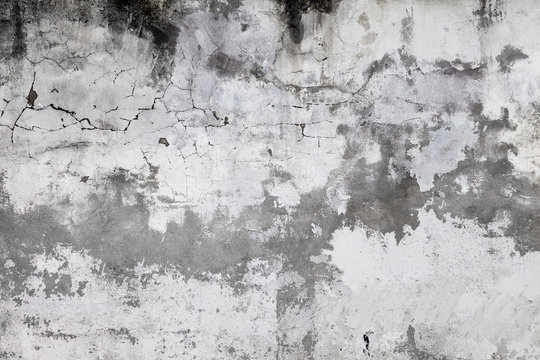 Cracked concrete wall covered with gray cement surface. Old grunge textures backgrounds. Plaster wall