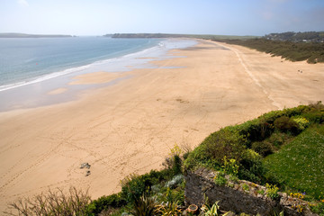 UK, Wales, Pembrokeshire, a view of South Beach at Tenby still empty of people in early spring sunshine