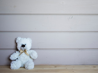 White bear toy for children stuff illustration, wooden bright background with space for your design or text