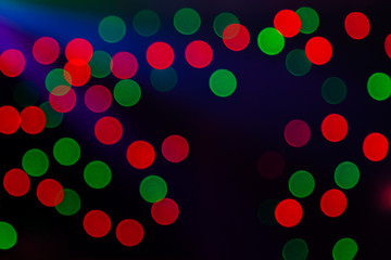 Red and Green bokeh lights for Christmas backgrounds with spotlight for production advertising