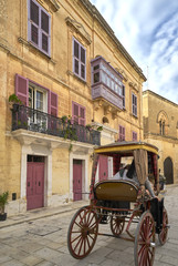 Horse-drawn carriage sightseeing tour in the historic city of Mdina on the main island of Malta