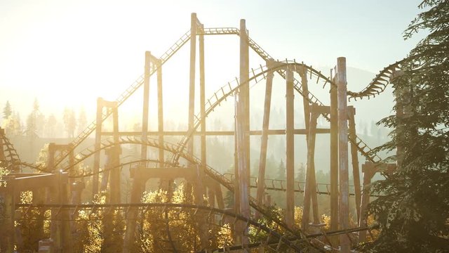 old roller coaster at sunset in forest
