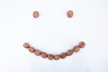Walnuts shaped smile concept photo, isolated on white top view photo