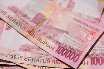 Close up of Indonesian money, 100,000 IDR banknotes 