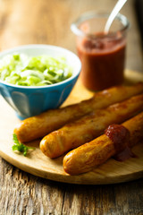 Fried sausages with strawberry ketchup