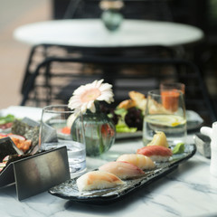 Delicious assorted sushi served outdoors