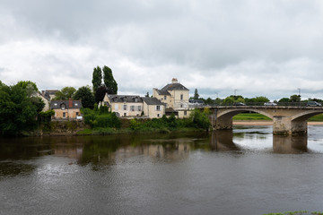 Fototapeta na wymiar View of Chinon and the bridge over the Vienne River from the northern bank, France