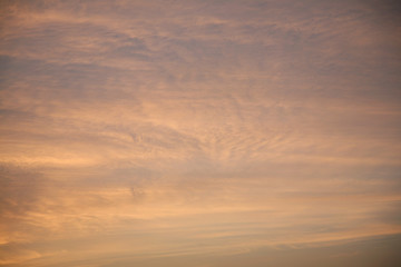 The sun  rays illuminate the sky with clouds. We see the background of the sky of natural color as in the picture. This image of a beautiful sky and white clouds pleases all people.
