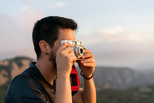 Spain, Barcelona, Natural Park of Sant Llorenc, man taking a picture of the view
