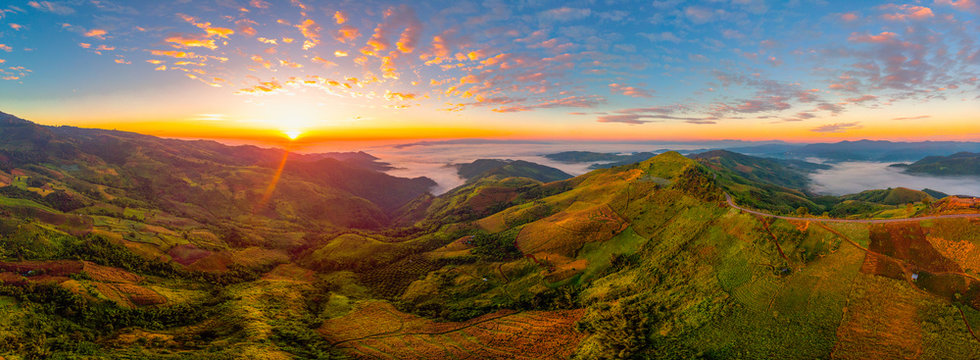Beautiful panorama air view of mountain rang with hightway road at sunrise time.