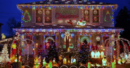 A closeup detailed view of a house heavily decorated for Christmas. Pittsburgh suburbs.  	