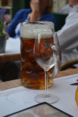 full beer glass, empty wine glass