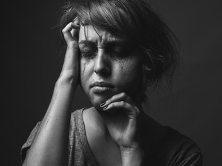 Young woman with smeared make up. Black and white