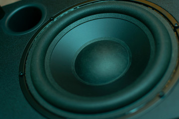 big black subwoofer speaker with bass reflex close up