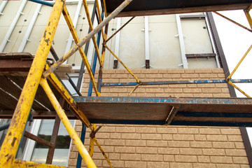 Installing siding on the walls of the house