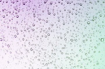 Colour gradient rain drops on window
