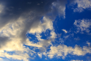 Clouds after rain before sunset as a background