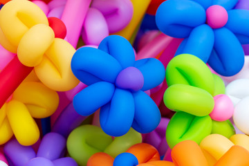 Multicolored flowers from balloons as background