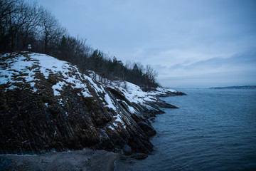 Cliffs on the islands around Oslo Norway over the winter overlooking the sea and the Fjord
