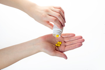 Medicine pills or capsules in hand