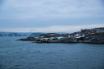 Cliffs on the islands around Oslo Norway over the winter overlooking the sea and the Fjord on horizont
