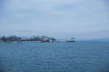 Cliffs on the islands around Oslo Norway over the winter overlooking the sea and the Fjord on horizont